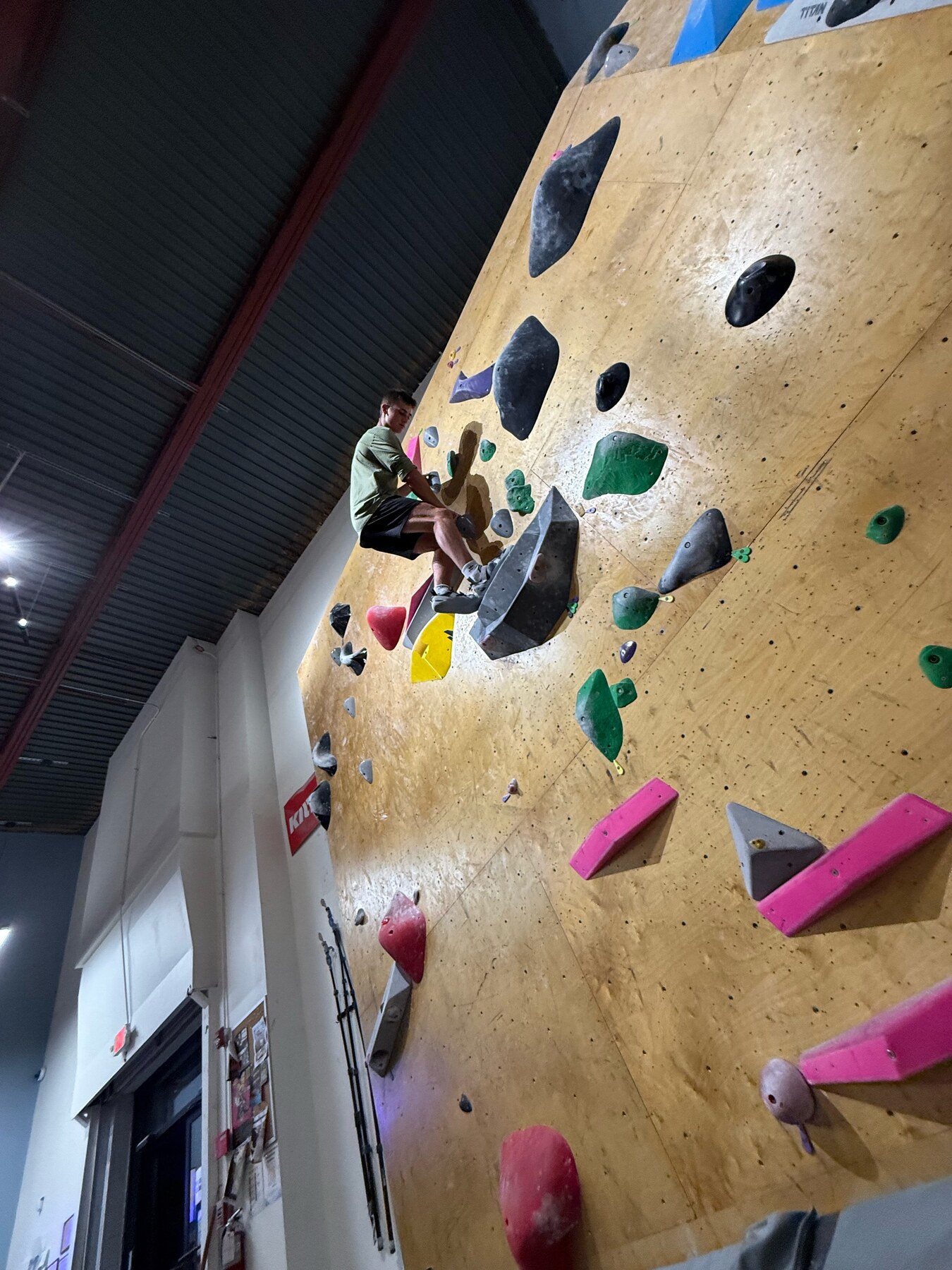 Indoor bouldering on an overhanging wall