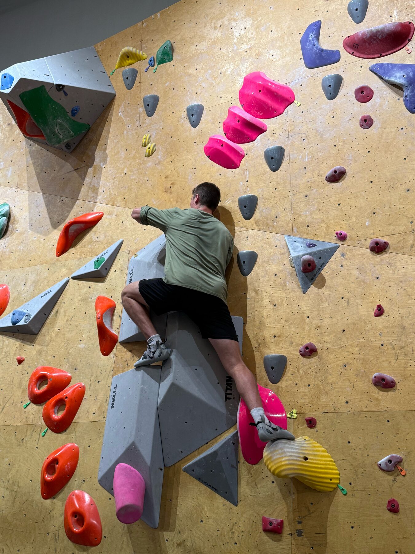 Indoor bouldering on a plywood wall